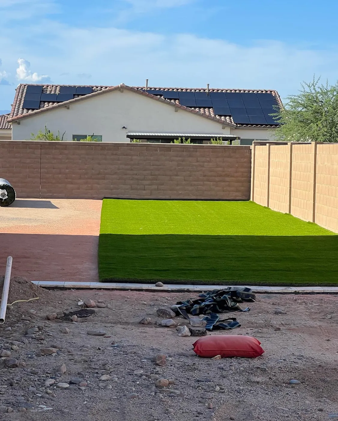Front yard rebuilt with fresh decomposed granite around a shade tree